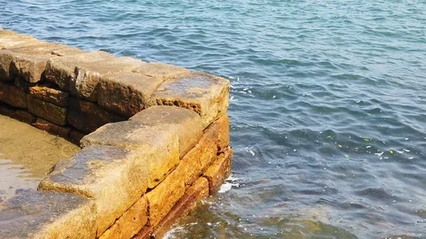 Stone wall on the coast Stock Footage 123882417