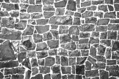 Stone wall of cobblestones background. View from the front. UNUSUAL SURFACE. 写真素材