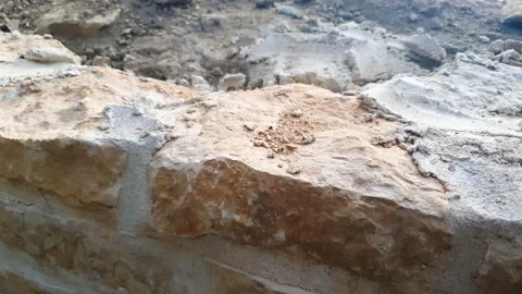 Stone Wall Construction. Natural Stone Construction. Mountain stone rocky tile Stock Footage 346082966