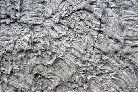 A stone wall covered in plaster Stock Photos