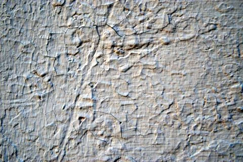 A stone wall covered in plaster Stock Photos