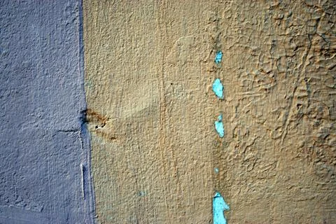 A stone wall covered in plaster Stock Photos