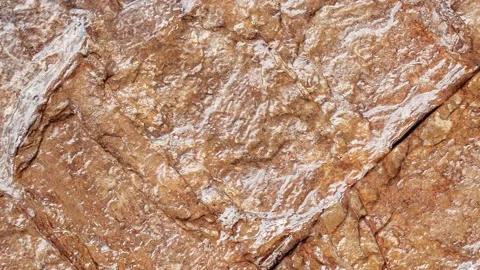 Stone wall covered with varnish, background rotating, turning, close-up mac.. Stock-Footage 256326276