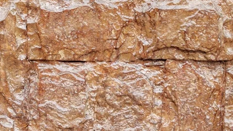 Stone wall covered varnish, close-up 動画素材 310797913