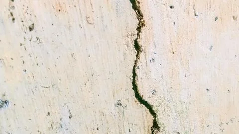 The stone wall is cracked Stock Photos