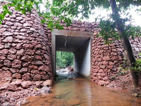 Stone wall of a culvert work for irrigation purpose Kerala Stock Photos