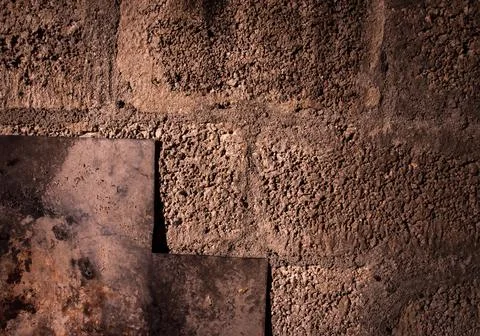 Stone wall dark background with light. Grunge style wall for background Stock Photos