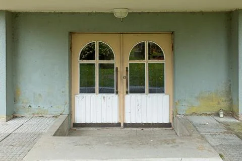 Stone wall with doors. Stock Photos