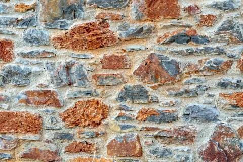 Stone wall fence rustic texture background close-up. 스톡 사진