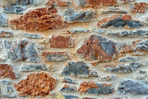 Stone wall fence rustic texture background close-up. Stock-Fotos
