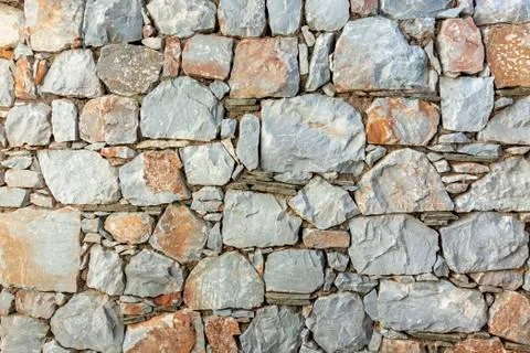 Stone wall fence rustic texture background close-up. 스톡 사진