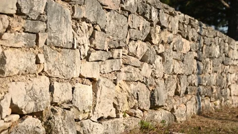 Stone wall in the field, close up. Medieval stone wall pattern. Stock Footage 204087441