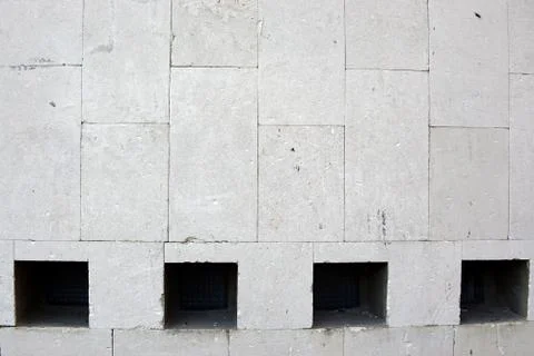 Stone wall with four windows close up Stock Photos
