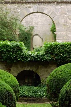 The stone wall in the garden. Stock Photos