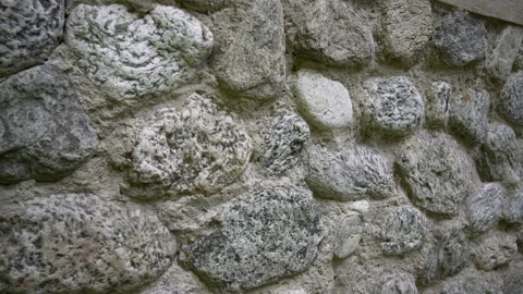 Stone wall, grey stone siding with different sized stones Stock Footage 158971484