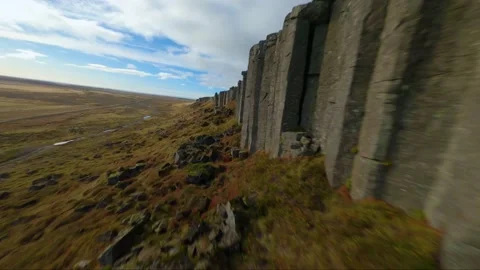 A stone wall of an interesting upright formation. Gerðuberg cliffs, Iceland Stock Footage 226370565