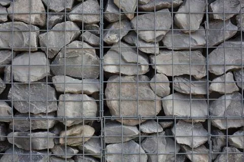 Stone wall with iron frame texture Stock Photos