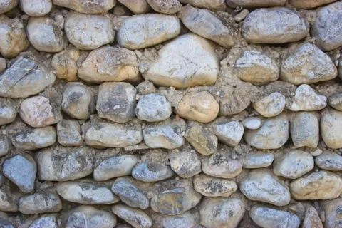 Stone wall lined with stone Stock Photos
