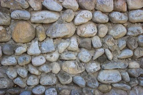 Stone wall lined with stone Stock Photos