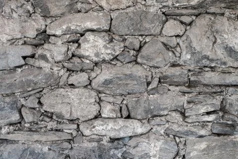 Stone wall of local stone Stock Photos