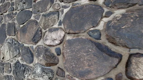 Stone wall made of large rocks and bould... | Stock Video | Pond5