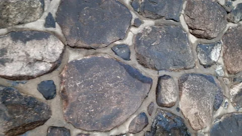Stone wall made of large rocks and boulders - abstract background and texture of Stock-Footage 232285594
