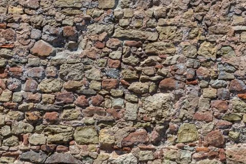 Stone wall made of old stone structure Stock Photos