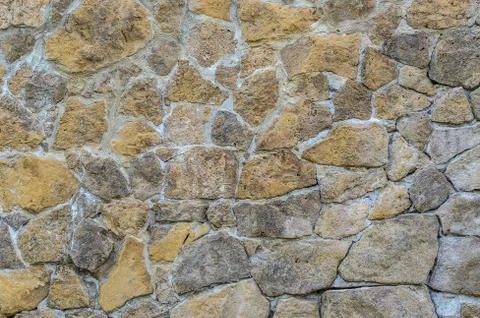 Stone wall masonry background Stock Photos