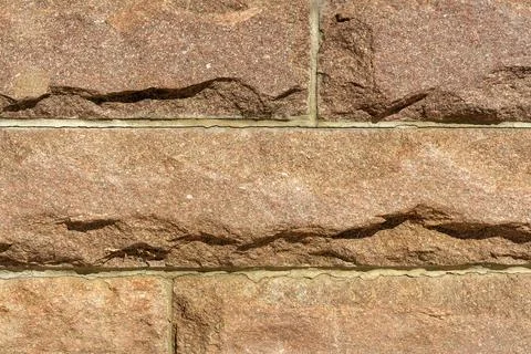 Stone wall masonry texture background close up Stock Photos