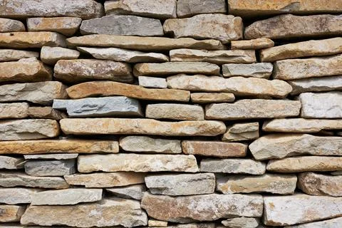 Stone wall. Old chalk stone pattern background. Natural background and wall.. Stock Photos