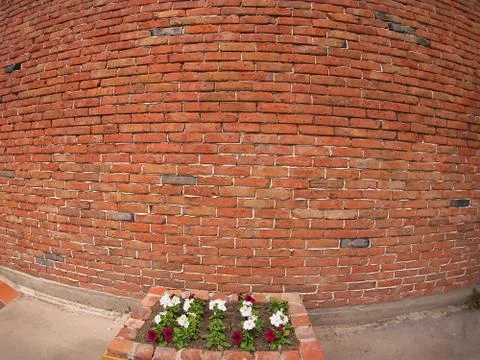 Stone wall of old red bricks with wide-shots distortion view Stock Photos