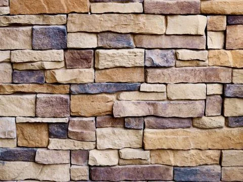 Stone wall for pattern and background Stock Photos