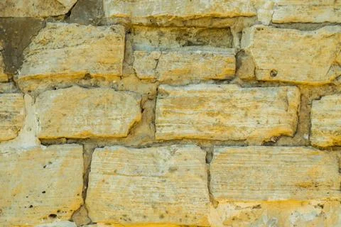 Stone wall pattern. Big concrete bricks outside. Stock Photos