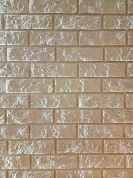 Stone wall pattern, decorative texture. Light beige brick wall background for in Stock Photos