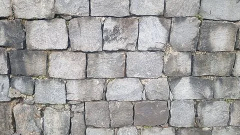 Stone wall pattern. Old castle stone wall background. Stock Photos