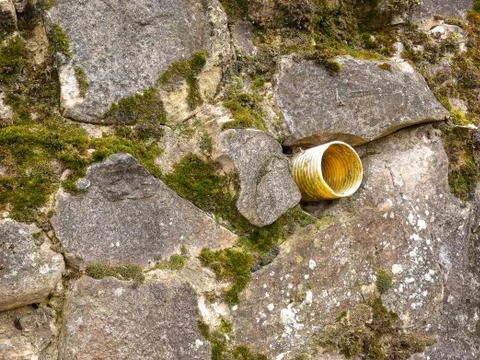 Stone wall with plastic ventilation wall drainage 스톡 사진