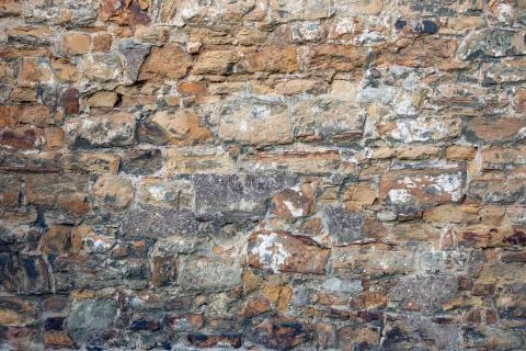 Stone wall with random tiled pattern Stockfoto's