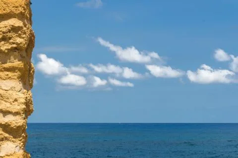 The stone wall with the sea Stock Photos