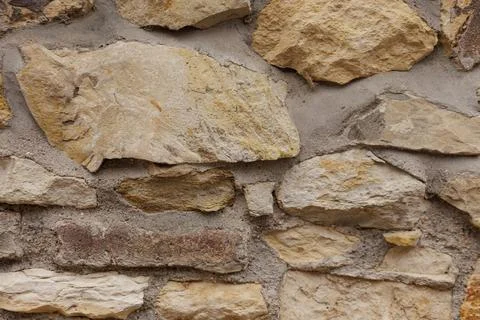 Stone wall showing rough surface texture background in Vysehrad Prague Stock Photos