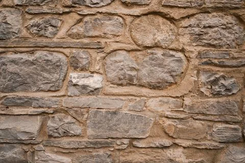 Stone wall structure of an old house Stock Photos