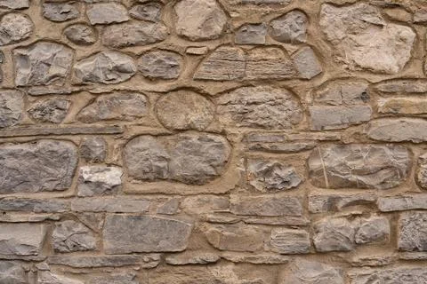 Stone wall structure of an old house Stock Photos