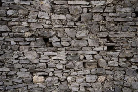 Stone wall structure of an old house Stock Photos