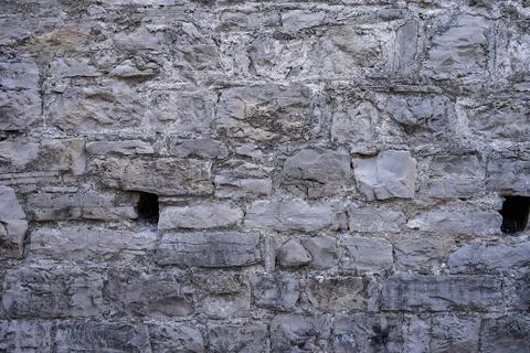 Stone wall structure of an old house Stock Photos
