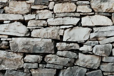 Stone wall structure of an old house Stock Photos