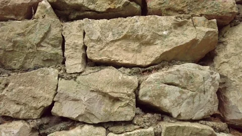 Stone wall is subtly changing its position, creating an abstract background Stock Footage 288594543