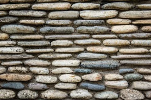 Stone wall surface with cement Stock Photos