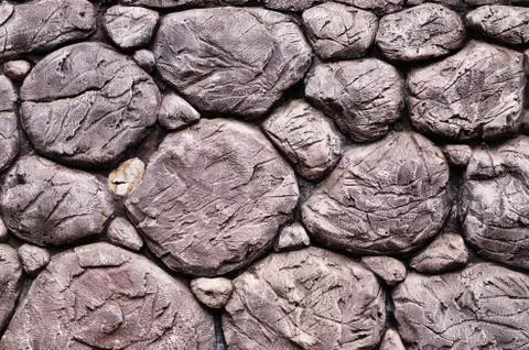 Stone wall surface with cement Stock Photos