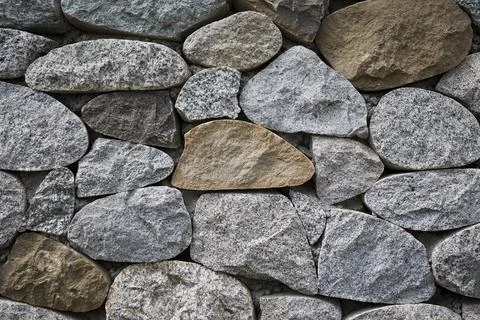 Stone wall texture background . Close up view Stock Photos