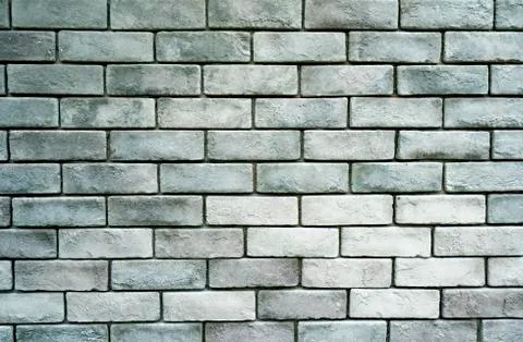 Stone wall texture background of grey brick stones. Stock Photos