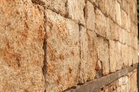 Stone wall texture background - grey stone siding with different sized stones Stock Photos